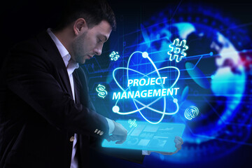Business, Technology, Internet and network concept. Young businessman working on a virtual screen of the future and sees the inscription: Project management