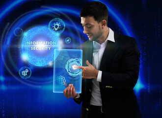 Business, Technology, Internet and network concept. Young businessman working on a virtual screen of the future and sees the inscription: Information security