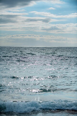 Sea abstract or rippled water texture background. Calm water surface texture with splashes and waves. Abstract nature background. Surface of blue ocean water.