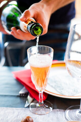 A kir cocktail with champagne at a festive table
