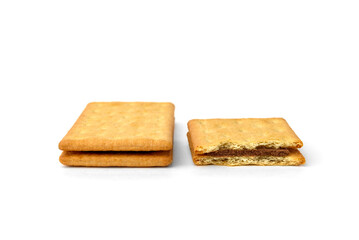 Cracker sandwich with chocolate filling isolated on white background.