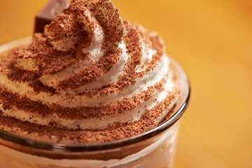 Chocolate powder sprinkled over whipped cream