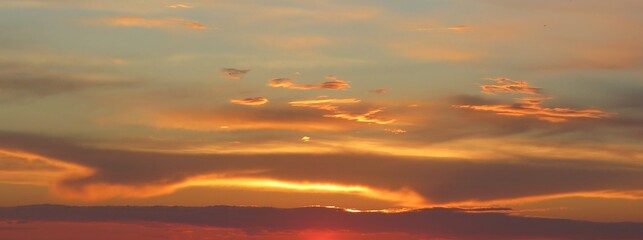 Beautiful orange golden sunset over the city as a background 