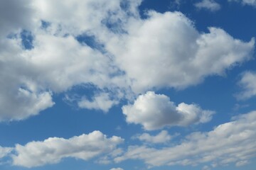 Naklejka na ściany i meble Beautiful shaped clouds in blue sky, natural background
