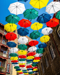Fototapeta na wymiar colourful umbrellas hanging over the street