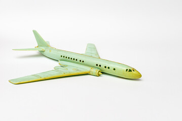 Miniature old commercial plane model on white background.Closeup.copy space.