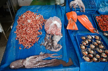 Freshly caught octopus, prawns, salmon fillets and scallops at local market in Valparaiso, Chile....