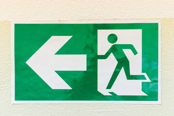 Green sign of strange escape way.Fire exit light sign.fire.Close up.