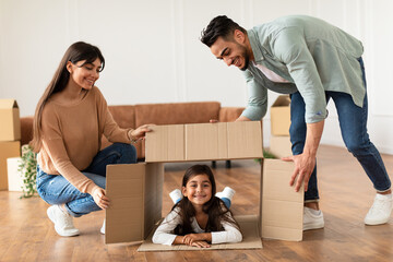 Happy loving young family celebrating relocation together