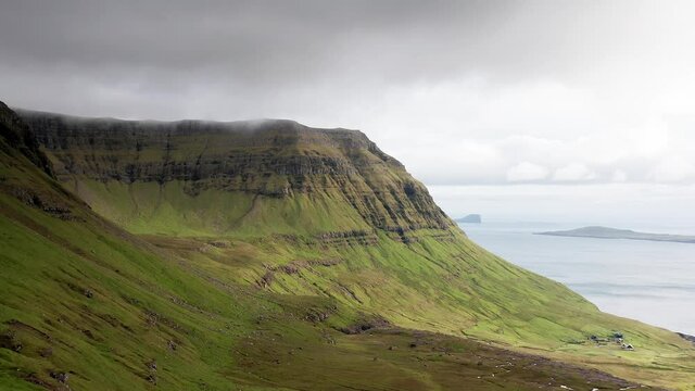 Aerial view of wilderness nature,islands, ocean, green mountain and rock cliffs.Impressions of the fascinating archipelago of the Faroe Islands in the North Atlantic Ocean
