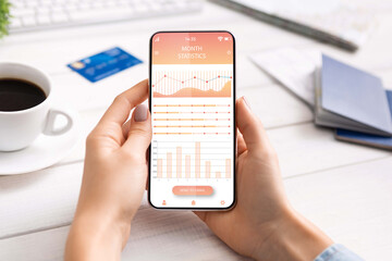 Cropped of business woman checking monthly statisticks of spendings
