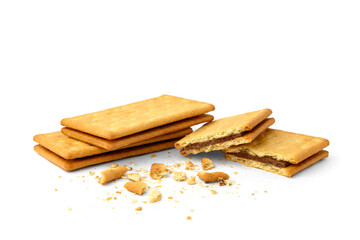 Pile of cracker sandwiches with chocolate filling isolated on white background.