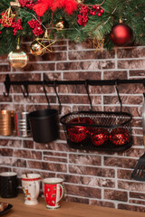 christmas tree branches decorated with Christmas toys in the kitchen