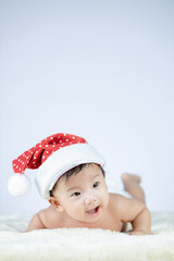Christmas portrait of cute little Baby wearing santa hat.