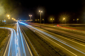 Fototapeta na wymiar Long exposure picture with light trails on motorway highway at night.