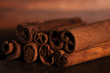 cinnamon and cassia sticks are close. brown condiment sticks on the side
