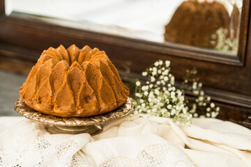 Still life with an apple sponge cakes.