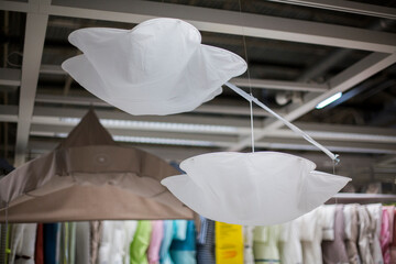 The lampshades and lamp shades are hanging in the shop window