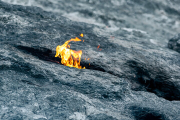 constantly burning fire at the place of a natural gas emission on Mount Chimaera (Yanartas), Turkey