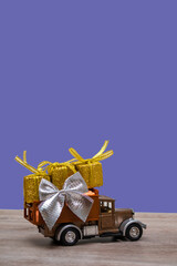 Retro car with gifts on a colored background. Vertical format copy space. Festive concept