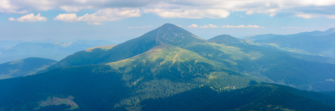 Hoverla the highest peak of ukraine. panoramic nature background. view in to the distant mountain ridge. beautiful landscape in summer. popular travel destination