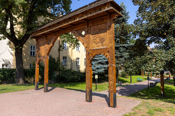 Fototapeta na wymiar Seklerska Gate, symbolic wooden carved gate, Tarnow, Poland