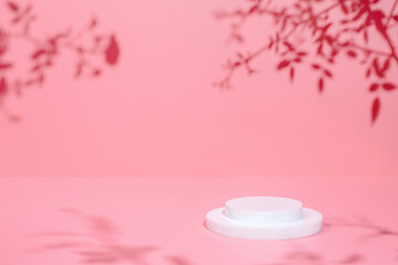 Abstract minimal nature scene - empty stage and circle podium on pink background and soft shadows of rose flowers and leaves. Pedestal for cosmetic product and packaging mockups display presentation