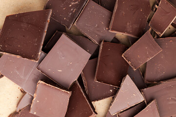a chocolate bar broken into more pieces