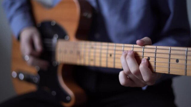 Modern music producer with live instrument, guitar sample pack for your daw. Hit solo on electric guitar, distance music learning. Concept of home studio