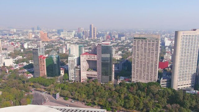 Mexico City: Aerial view of capital city of Mexico, park Bosque de Chapultepec and city centre skyline with modern high-rise buildings (skyscrapers) - landscape panorama of North America from above
