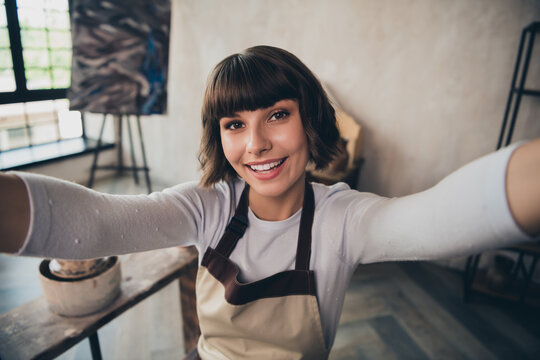 Portrait of pottery owner self-employed lady make selfie at traditional artwork seminar blogging in workroom