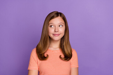 Fototapeta premium Portrait of attractive cheery curious brown-haired girl thinking copy space isolated over bright violet purple color background