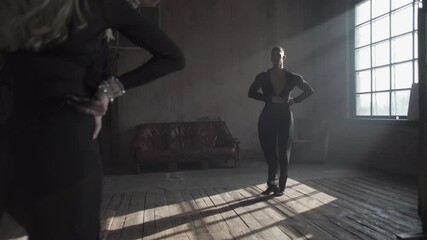Man invites to dance his woman partner. Couple of two professional ballroom dancers is dancing on loft studio.Beautiful art performance with heavy smoke. 