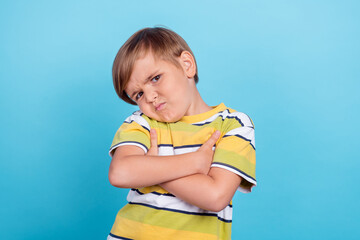 Photo of young unhappy upset boy hands crossed bad mood displeased negative isolated on blue color...