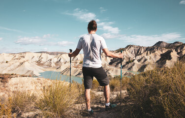 man travel in Spain- Murcia, blue lake and dunes (Embalse Algeciras)