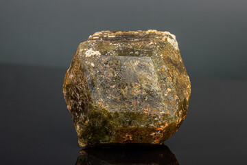 macro mineral stone Andradite on a black background