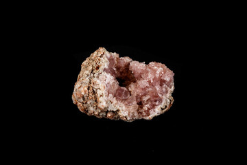 Macro mineral stone Pink Amethyst on a black background