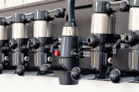 Beer taps for draught drinks are built into wooden boards in pub