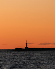 silhouette lighthouse at sunset