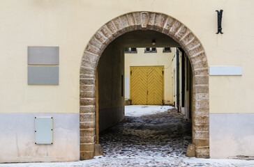 Arch in the urban historic building front view, Tallinn, Estonia

