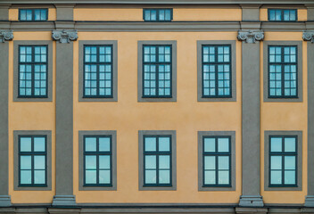 Many windows on facade of the urban historic building front view, Stockholm, Sweden
