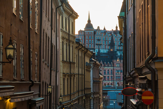 Perspective view of historical buildings on the Tyska Brinken Street at sunset, Stockholm, Sweden
