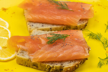 smoked salmon toast on yellow plate