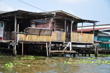 Poor and dirty hovel on the Chao Phraya riverside in province, Thailand