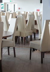 Abstract modern interior of cafe or meeting room with rounded armchairs