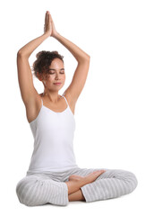 Fototapeta premium Beautiful African-American woman meditating on white background