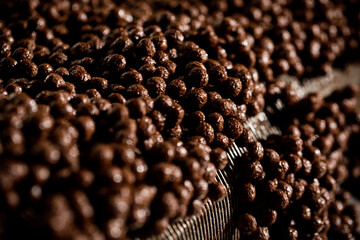 CEREAL AND COOKIE FACTORY. CLOSE UP AND DETAIL OOF PRODUCTION LINE. High quality photo