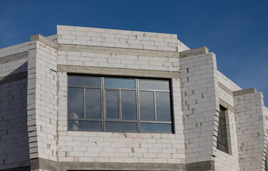 House under construction. Prefabricated building elements. Cement