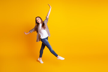 Fototapeta na wymiar Full size profile side photo of young cheerful lovely girl good mood go playful fool isolated over yellow color background