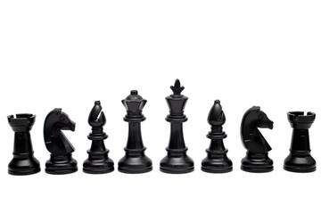 Set of black chess pieces are lined up isolated on a white background - Powered by Adobe